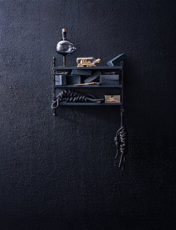 String Pocket i färgen Nybroblå med flaskskepp, knopar och tegelstenar