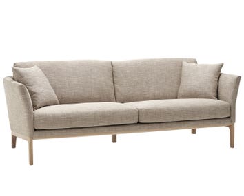 Lola soffa från Bröderna Anderssons i gråbeige tyg med bensockel i massiv ek