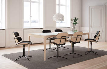 GM 3700 Ro Bord i matsal på brun matta med svarta matstolar