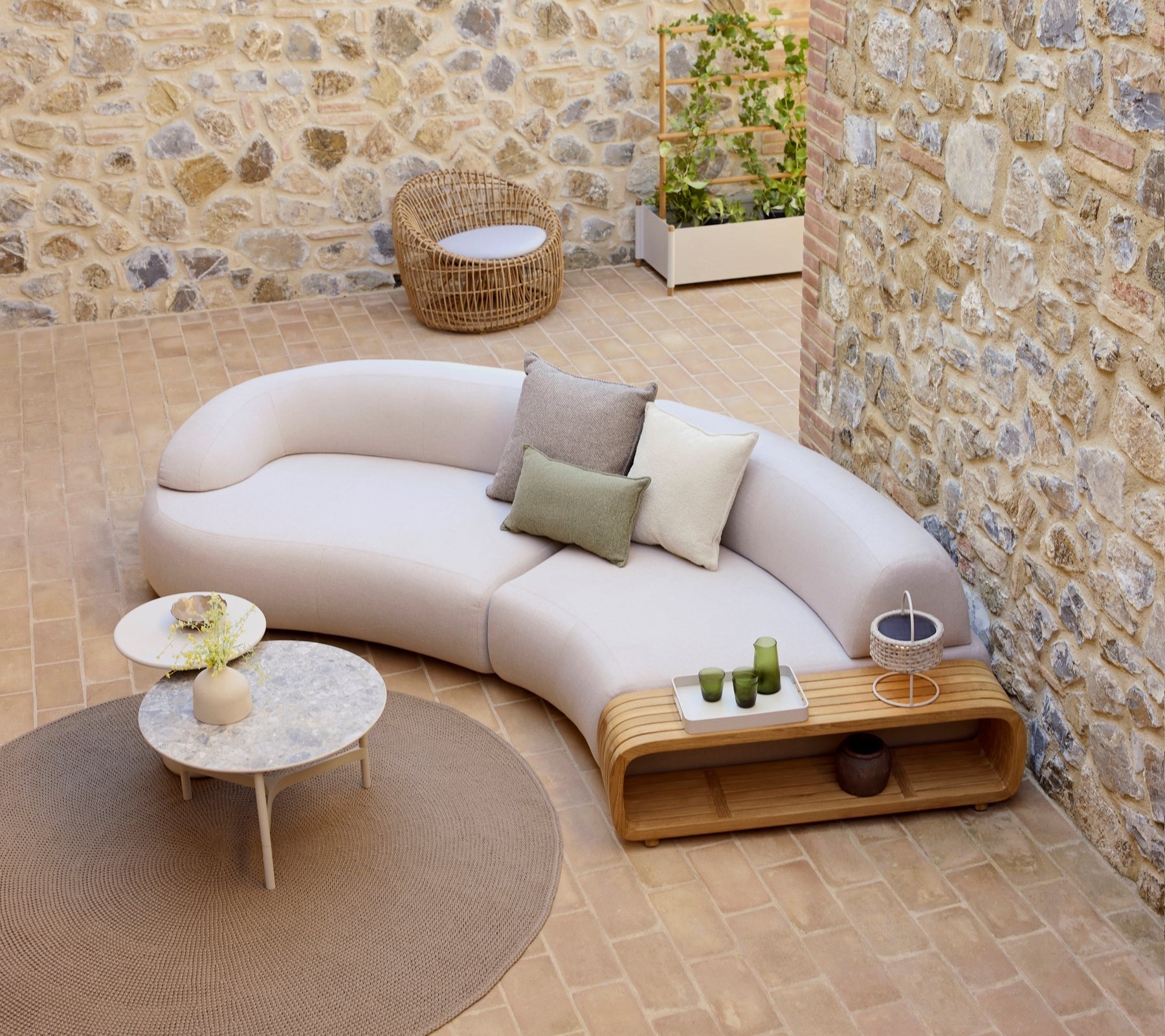 Cane-line-miljo-Mellow_sofa_-_Mellow_coffee_table_-_Nest_round_chair_-_twist_-_Illusion_6524_1de4b29e-55af-4c78-b54a-8eb2375e6cb5