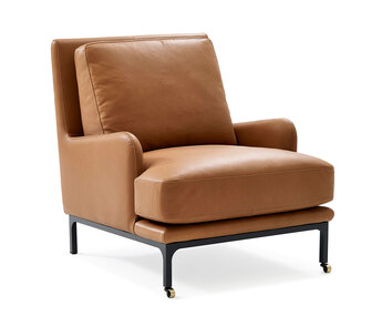 Fåtöljen Mr. Jones, med hjul. Fåtöljen är klädd i Master 53. 