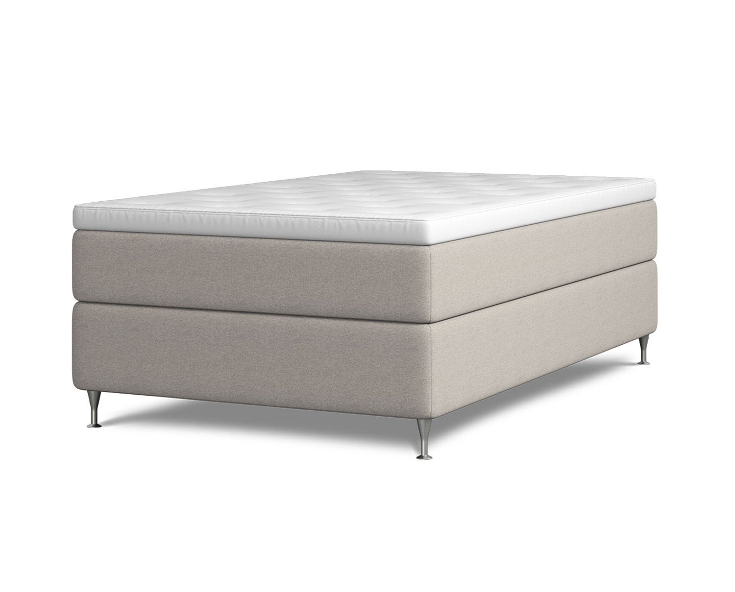 Kontinentalsängen Harmoni.  Bilden visar Harmoni med en bredd av 120 centimeter. Sängen är klädd i beige tyg. Benen är av förkromat stål. 